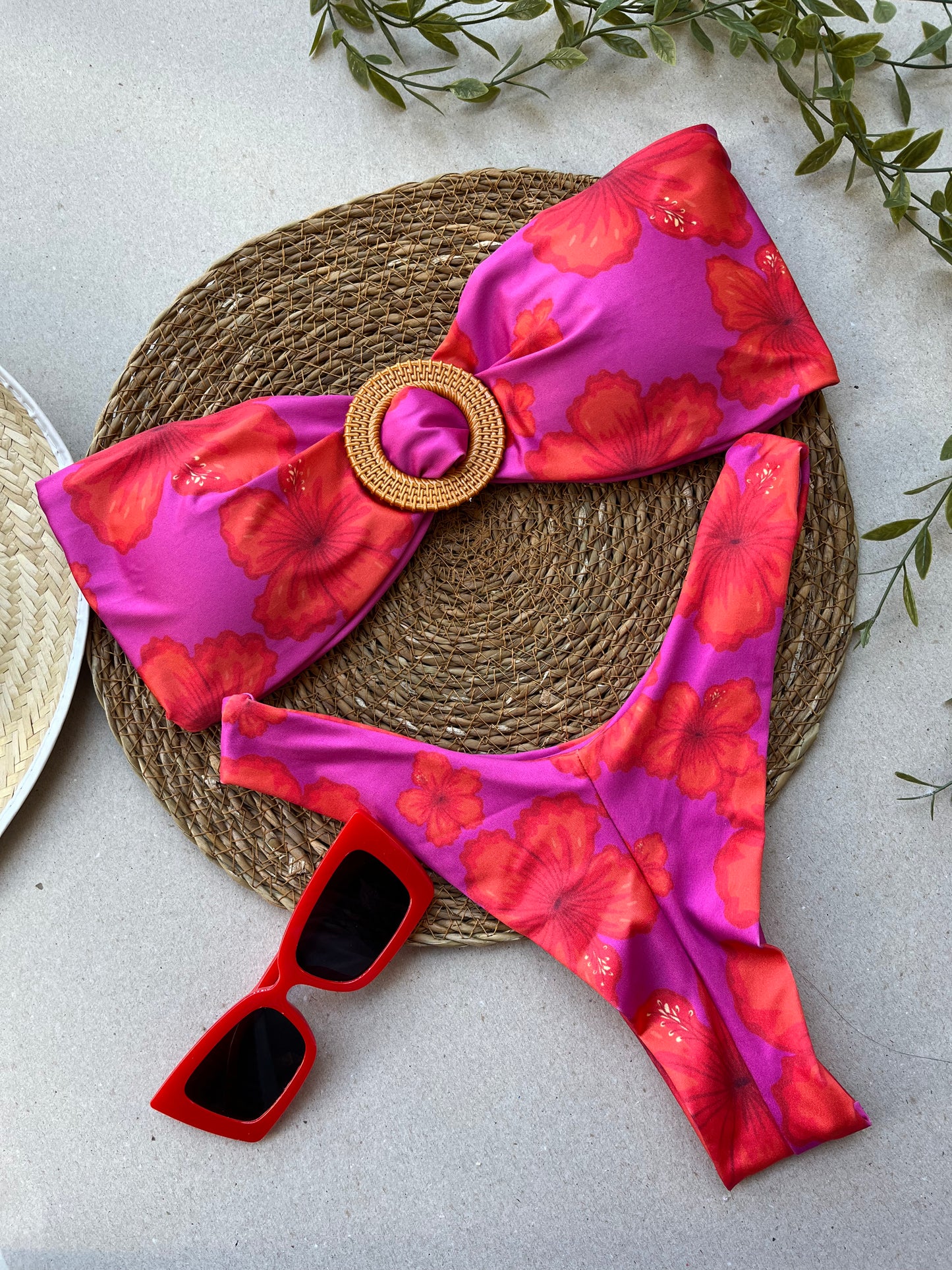 Colorful bandeau bikini set with acrylic ring and high-leg bottom on white background
