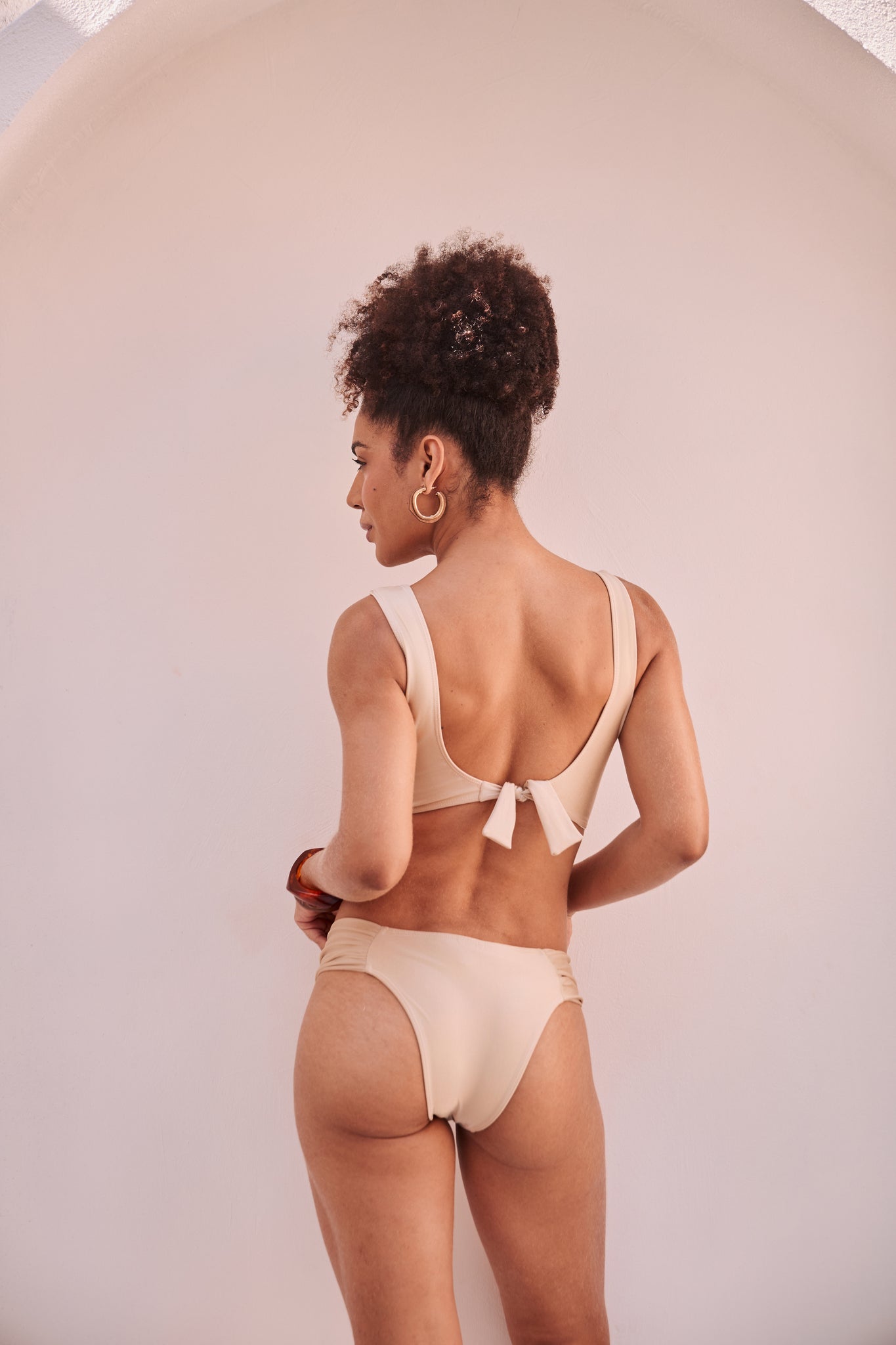Orixah Solstice Ruche Bikini in beige with ruched sides and tie-back bow, rear view