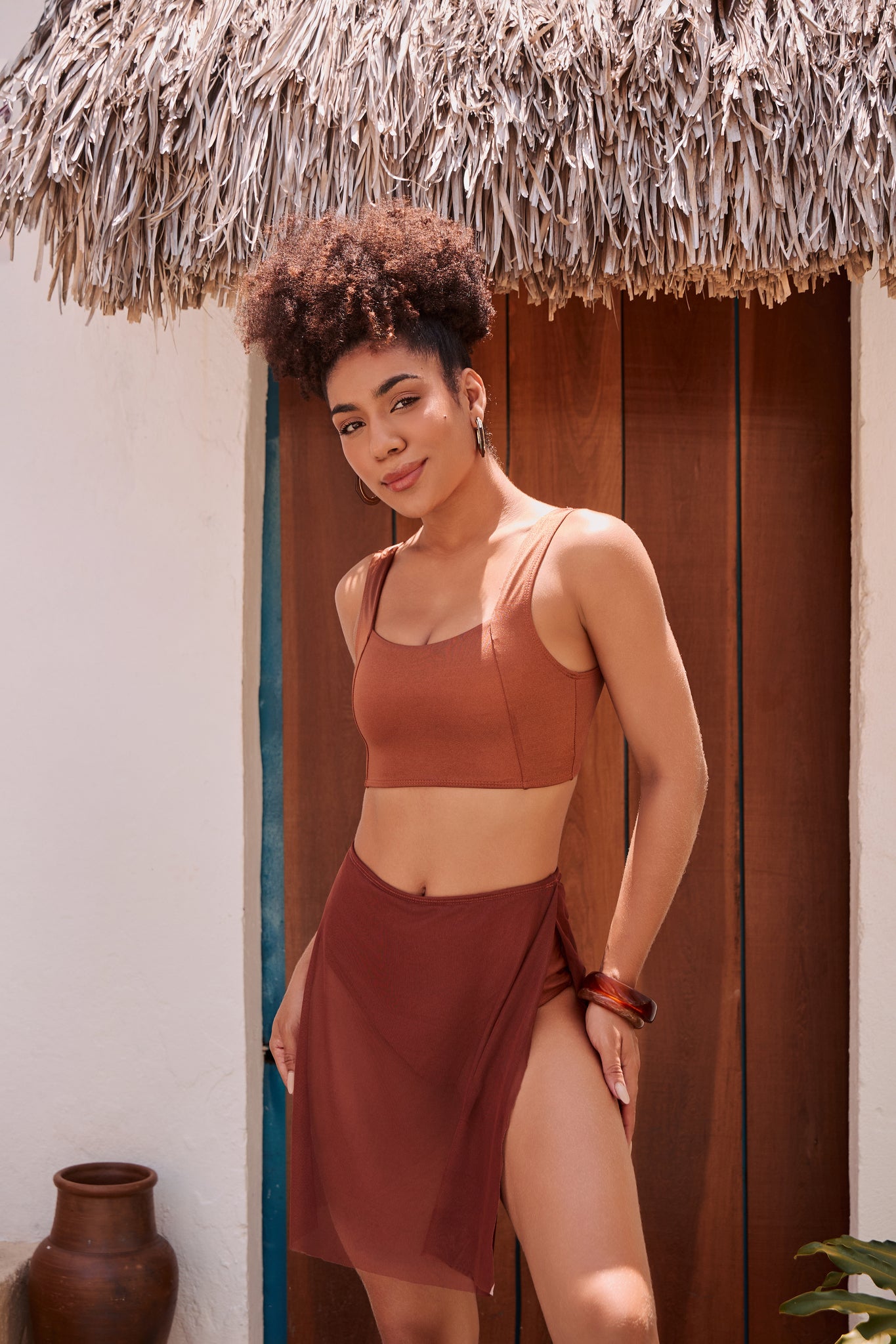 Orixah Suntrail Resort Set in rust with high-slit skirt, hoop earrings and bracelet, front view
